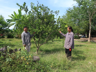 Two farmers in their field in Cambodia