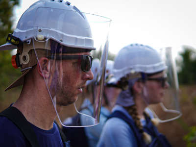 HALO staff wearing visors in the field