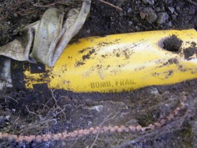 Close up image of a NATO cluster bomb uncovered in the soil in Kosovo