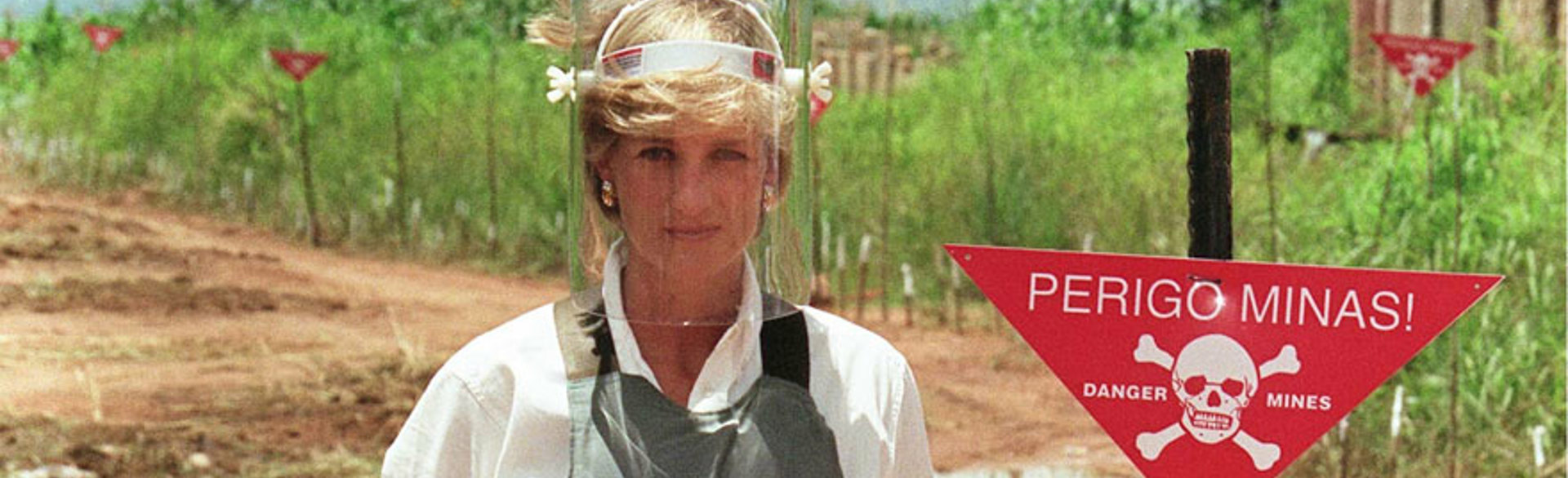 Princess Diana standing in a minefield in Angola in 1997