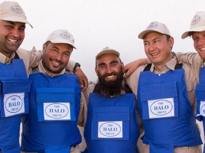 A team of dedicated deminers smile for a group photo following the clearance of districts in Herat Province, Afghanistan