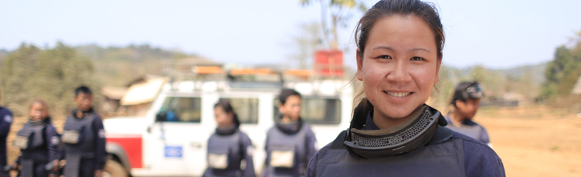HALO team leader in Cambodia standing on a minefield with the local team