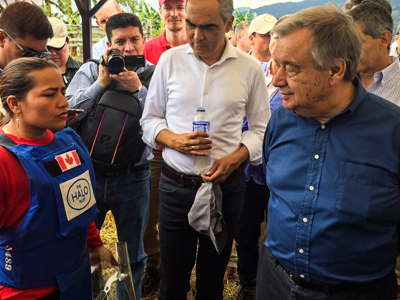 United Nations Secretary, General António Guterres, stands with a HALO staff member