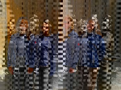 Group of 4 women wearing HALO Trust jumpers