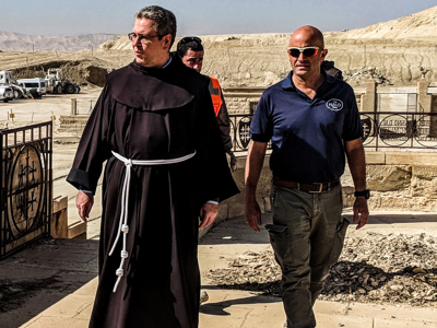 The head of the Franciscan Mission in Jerusalem visits their churchyard at the Baptism site of Christ.