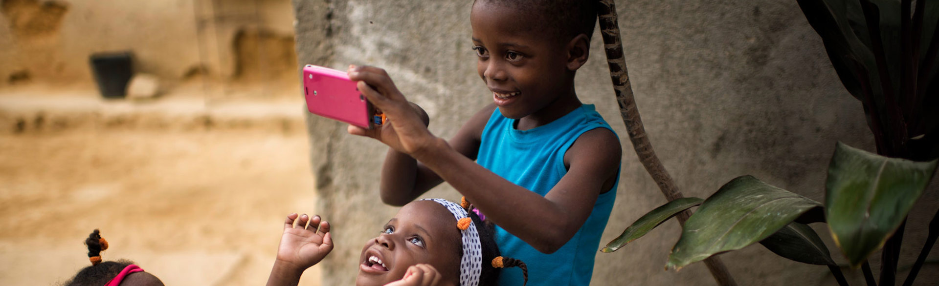 A child takes a photo in Angola