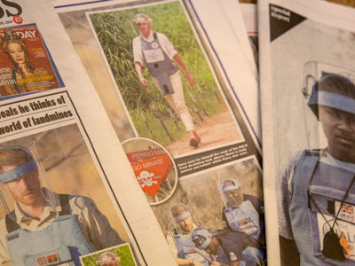 News articles with Prince Harry and Diana wearing PPE and deminers in Angola